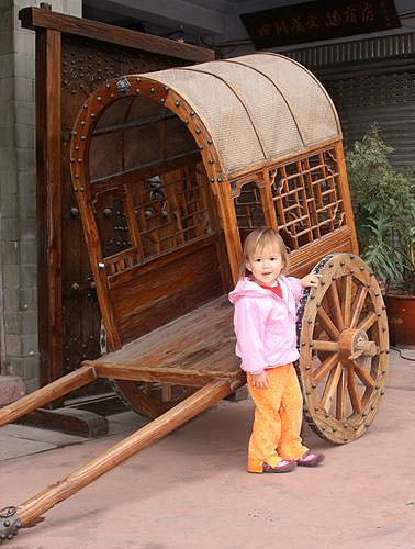 Kaili in Chinese horse drawn cart / carriage
