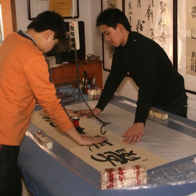 Adding a backing of more xuan paper to the artwork