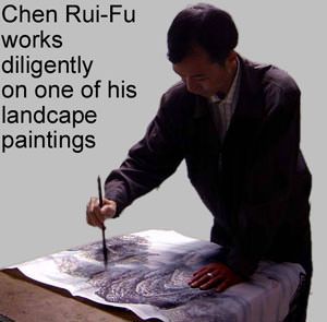 The artist Chen Rui-Fu practices his art of creating beautiful Chinese landscape paintings