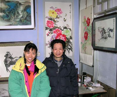 Chinese artist Cheng Zheng-Long and Cat at his studio in Chengdu, China