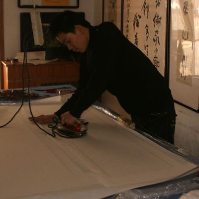 Ironing the back after adding silk and keyline tape