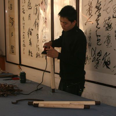 Preparing wall scroll rollers