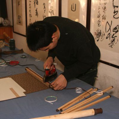 Finishing the wall scroll roller installation
